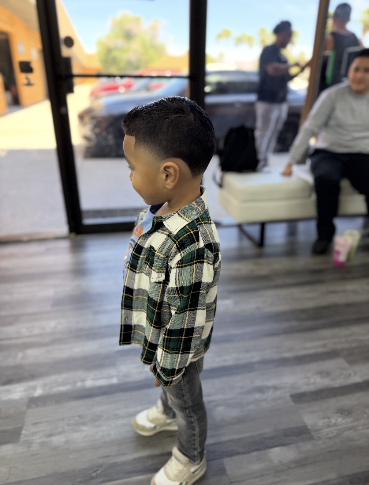 Young boy with a fresh taper haircut inside dbarbershop
